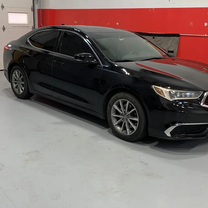 Black sedan in the shop